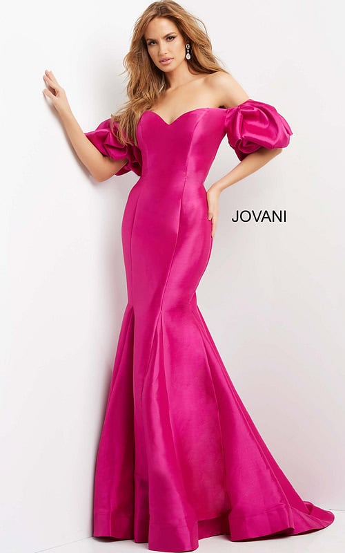 Model wearing Jovani 09031 pink off-the-shoulder gown with a sweetheart neckline and mermaid silhouette.