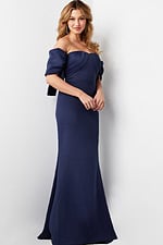 Model wearing Jovani 09064 navy dress with off-the-shoulder design and pleated bodice.