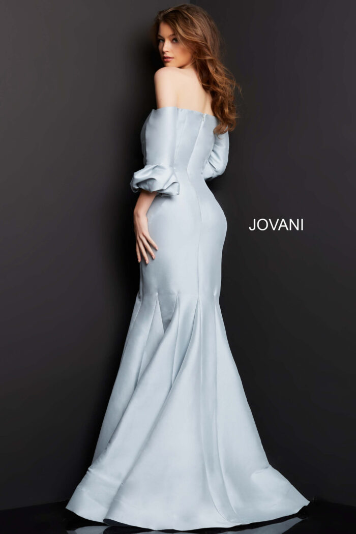Model wearing Jovani 09420 silver dress, back view with detailed fabric draping