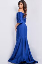 Model wearing Jovani 09420 blue dress, back view highlighting mermaid cut