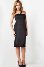 Model wearing Jovani 09440 black dress with asymmetrical neckline and fitted silhouette front view.