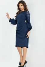 Model wearing Jovani 09471, navy dress with balloon sleeves featuring lace details, front view