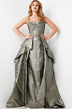 Model wearing Jovani 09481 silver version of the gown, front view with layered skirt.