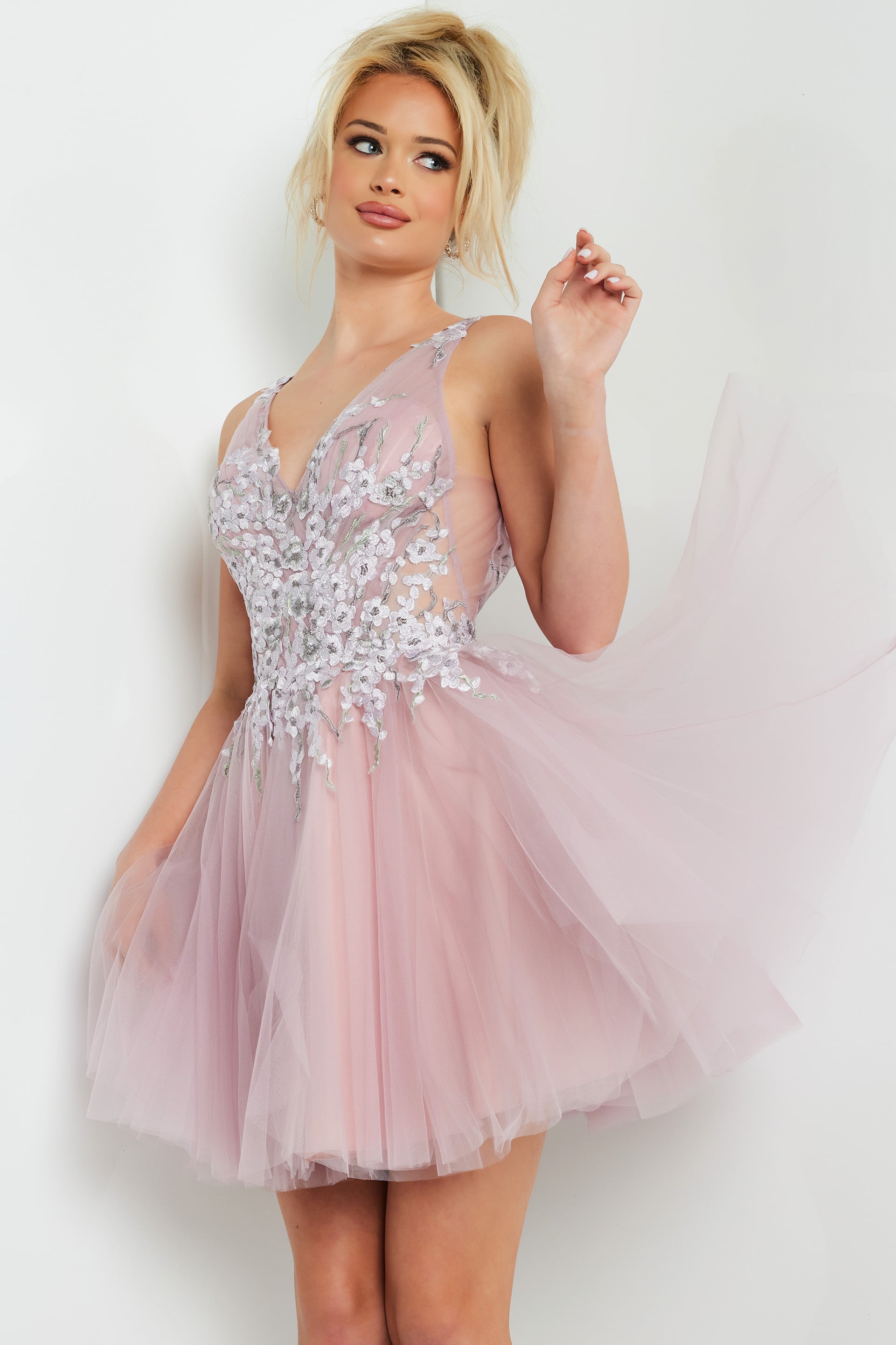 09518-MAUVE-206.jpg model wearing Jovani 09518 blush mini dress with floral applique and V-neckline
