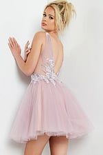 back view of model wearing Jovani 09518 blush mini dress with low scoop