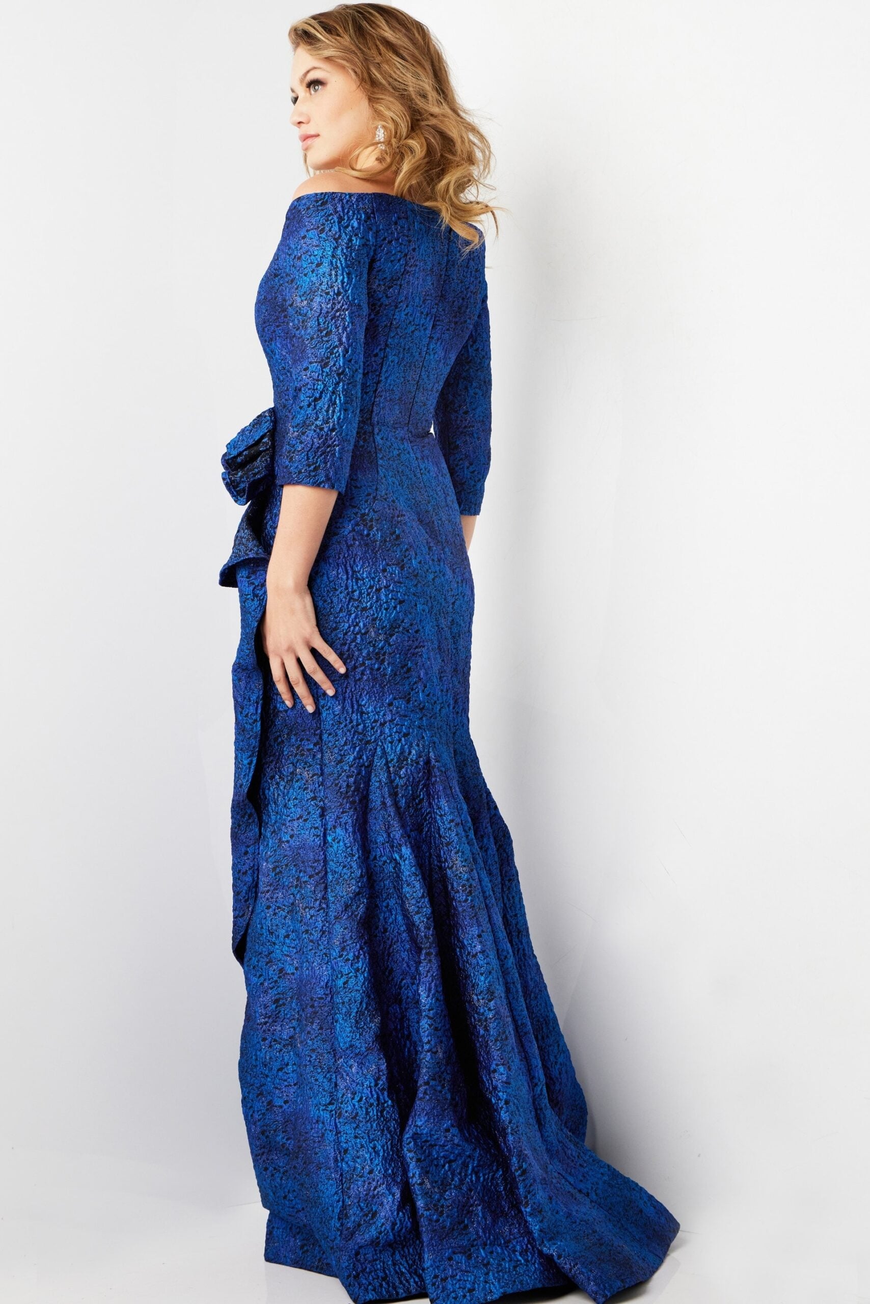Model showing back of Jovani 09550 blue dress
