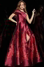 Model wearing Jovani 09610 red dress with asymmetric neckline and floral embroidery.
