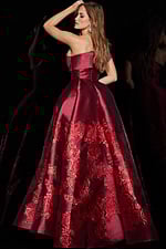 Back view of model wearing Jovani 09610 red dress showing smooth back detail.