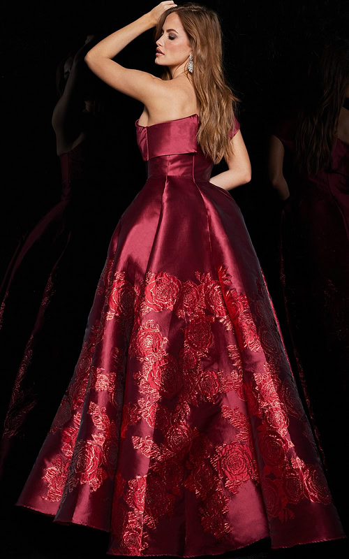 Back view of model wearing Jovani 09610 red dress showing smooth back detail.