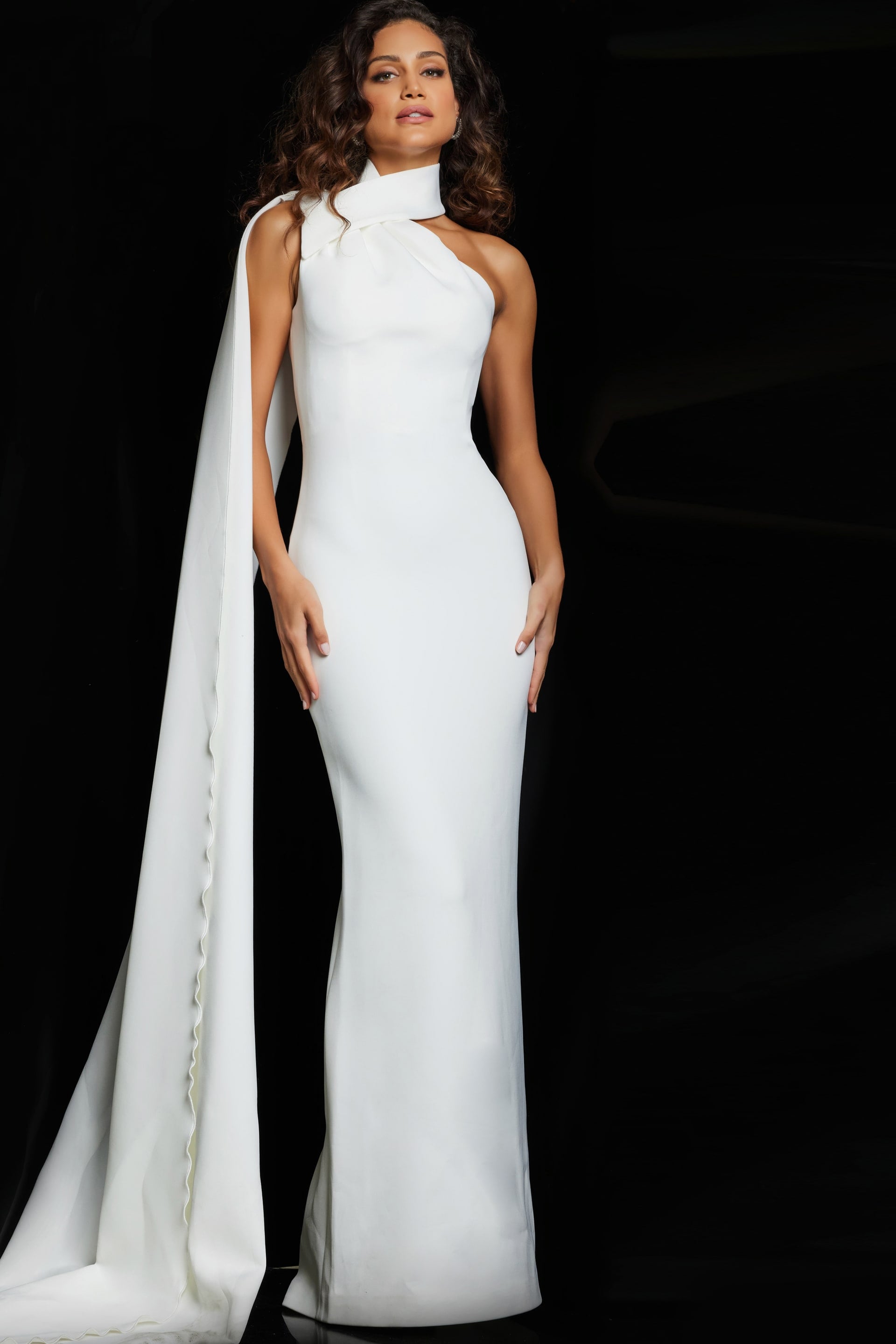 09709_WHITE_4.jpg Model wearing Jovani 09709 white sheath dress with high neckline and cascading wrap detail
