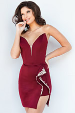 Model wearing Jovani 09744 burgundy dress with V-neckline and side embellishments, front view.