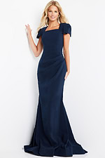 Model wearing Jovani 09757 navy gown with a side view