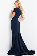 Model wearing Jovani 09757 navy gown from the back