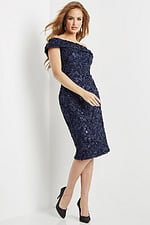 Side front view of model in Jovani 09767 navy off-the-shoulder knee-length dress.