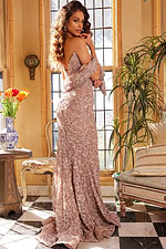 Model wearing Jovani 09768 in cafe from back angle, displaying elegant off-shoulder look.