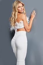 Back view of model in Jovani 09835 with ivory feather top.