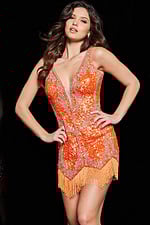 Model wearing Jovani 09906 sequin short dress in orange, showing off the neckline