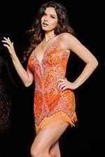 Model wearing Jovani 09906 sequin short dress in orange, front view with fringe hem