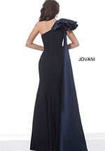 Back view of model wearing Jovani 1008 navy dress with one shoulder and dramatic ruffle detail.