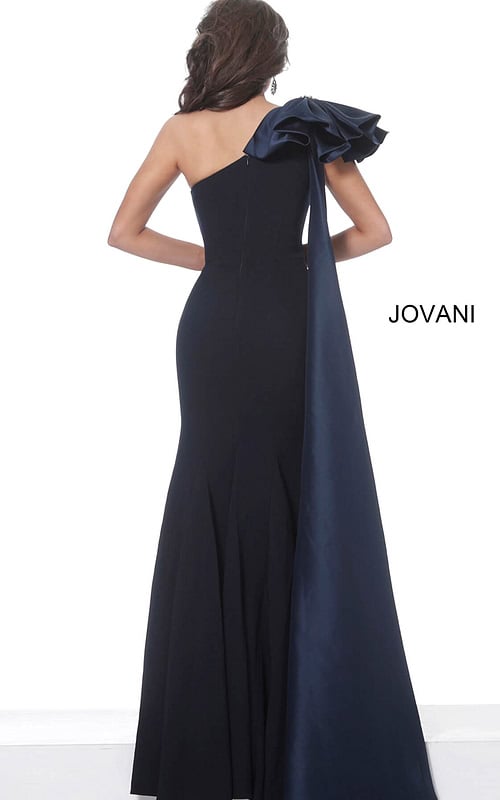 Back view of model wearing Jovani 1008 navy dress with one shoulder and dramatic ruffle detail.