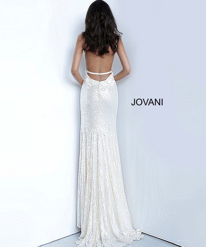 Model in Jovani 1012 white dress featuring floral designs and high slit