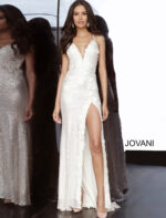Main image of model in Jovani 1012 white gown with high slit and floral appliqués.