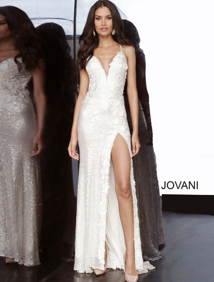 Main image of model in Jovani 1012 white gown with high slit and floral appliqués.