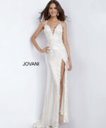Model wearing Jovani 1012 cream gown with low back and floral embellishments.