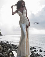 Model in Jovani 1012 ivory dress with floral appliques and high slit