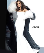 Front view of model in Jovani 1226 showing feathered sleeve details.