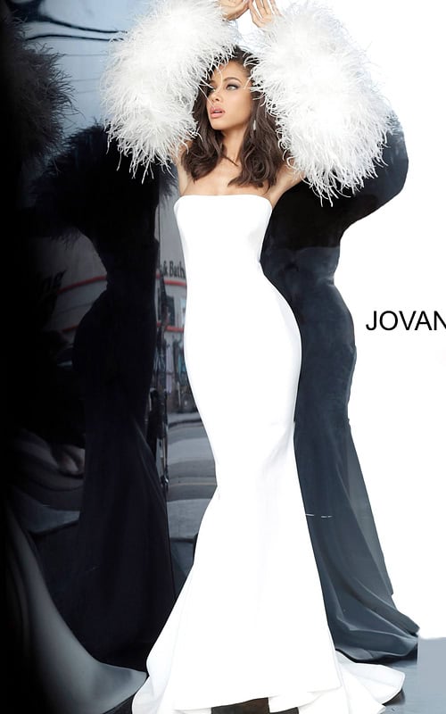 Model wearing Jovani 1226 white gown with feathered sleeves, front view.