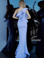 Model wearing Jovani 1307 dress in light blue, back view showing ruffle details.