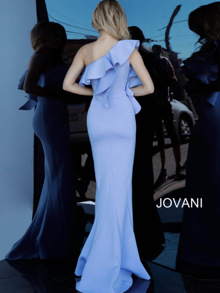 Model wearing Jovani 1307 dress in light blue, back view showing ruffle details.
