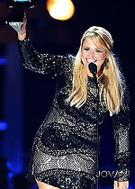 Model wearing Miranda Lambert in Jovani