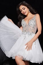 model wearing Jovani 1774 white cocktail dress with floral embellishments and tulle skirt