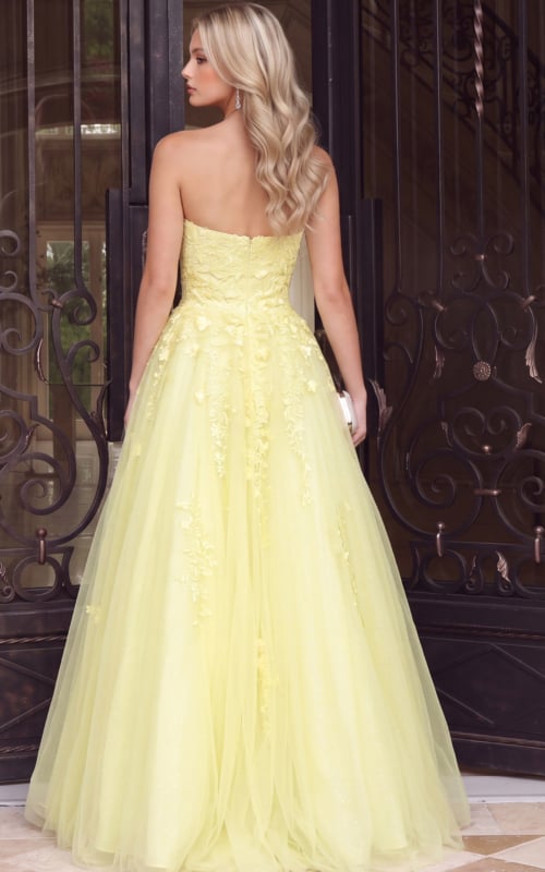 back of strapless floral yellow ball gown