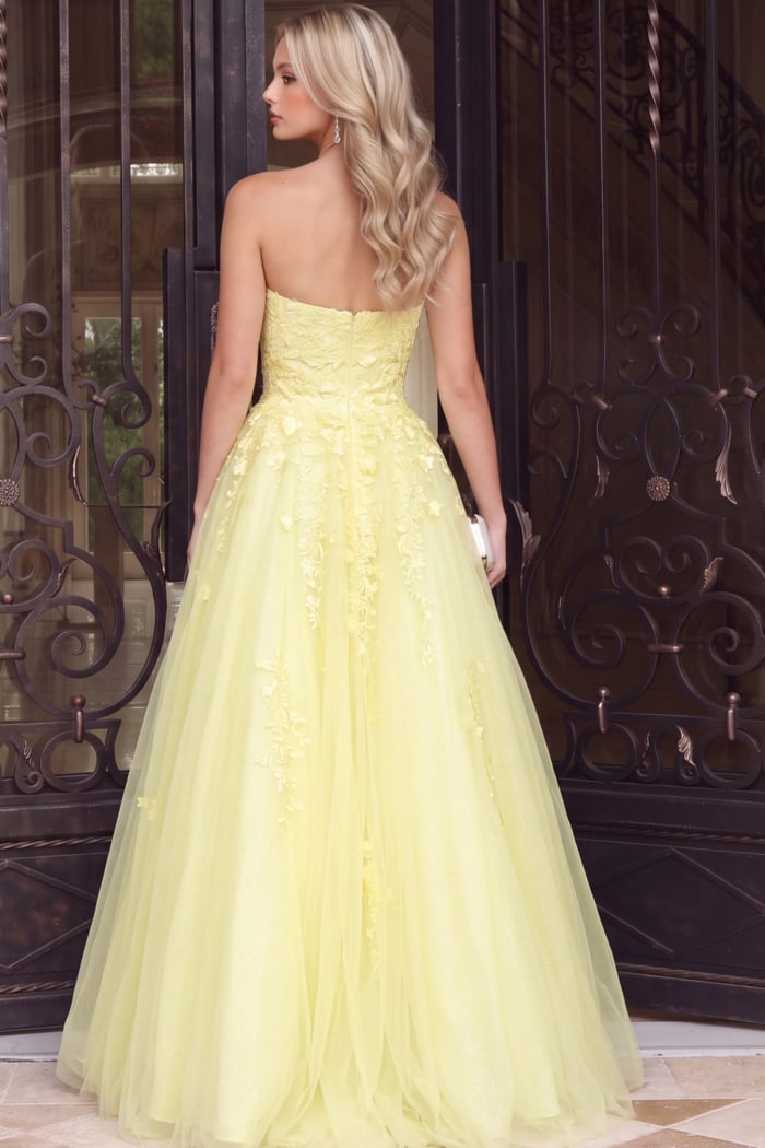 back of strapless floral yellow ball gown