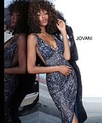 Front view of Jovani 1863 navy dress with intricate sequins and high slit.