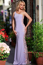 Model wearing Jovani 220490 lilac dress, front view in garden setting.