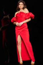 model in red Jovani 220710 dress, showing off-the-shoulder neckline and high slit design