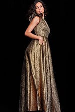 Model wearing Jovani 22268 gold gown with asymmetric ruffle strap, side view.