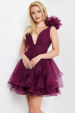 Model wearing Jovani 22279 burgundy dress with deep V-neck and layered ruffles.