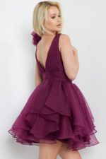 model showcasing back of Jovani 22279 burgundy dress with floral shoulder