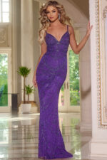 Model wearing Jovani 22286 floor-length fitted gown with beadwork, featuring a V-neckline and lace-up back in blue.