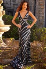 model wearing Jovani 22314 black sequin mermaid dress with plunging neckline