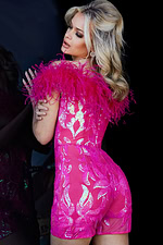 Back view of model in Jovani 22349 pink mini dress with feather detailing.