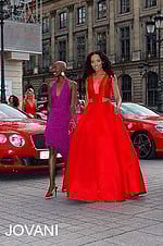 Model wearing Jovani 22613 royal gown with V-neckline and A-line silhouette