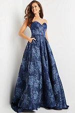 Model wearing Jovani 22792 navy gown with a front view in elegant pose.