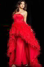 Model showcasing front of the Jovani 22817 red dress with feather accents.