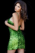 Model in Jovani 22905 green sequin mini dress with shimmering sequins and fitted design.